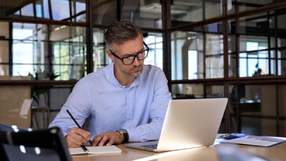 Man using laptop to get more value from enterprise data with MongoDB and Studio 3T